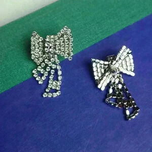 Silver tone clear rhinestones bow earrings